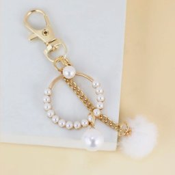 Světové Zboží Přívěsek na tašku White ring - zlatá
