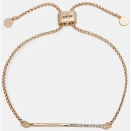 DKNY Pulsera Core dorada con cristal. Blanco