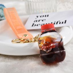 Porte-clés de bouteille de dessin animé pour femmes liquide mobile acrylique porte-clés de glace