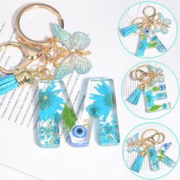 Porte-clés bleu créatif petite fleur séchée d'android porte-clés papillon pendentif pompon