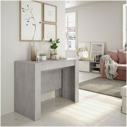 Table console extensible. 4 extensions s'ouvrent jusqu'à 237 cm. Pour 10 personnes. Couleur Ciment.