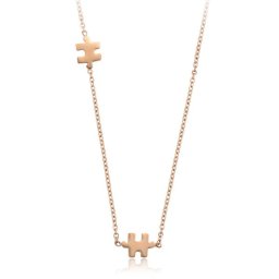 Puzzle nemesacél nyaklánc rozé arannyal