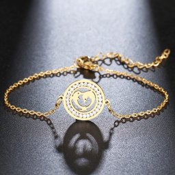 Delfinek, kristályokkal díszített nemesacél karlánc - arany bevonattal