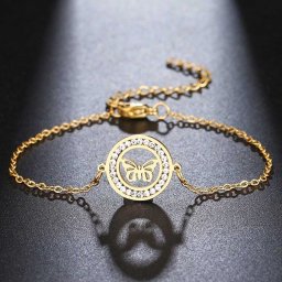 Pillangó, kristályokkal díszített nemesacél karlánc - arany bevonattal