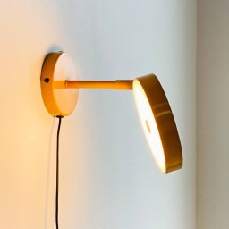 Dyberg Larsen LED wall lamp Starlight, yellow, Ø 14 cm, dimmable