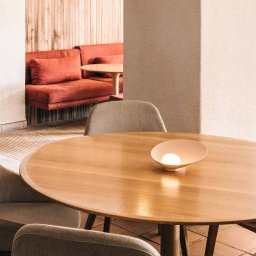 Vibia Musa 7402 LED table lamp lying, salmon
