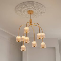 Nuura Aps Nuura LED chandelier Asteea 9, Ø 66 cm, brass-coloured/clear