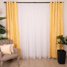 Set 3 piese Hiko, 2 draperii din bumbac, cu inele plastic, Nostalgie Baroc Garden Galben si o perdea Ana voal, cu rejansa pentru Bara