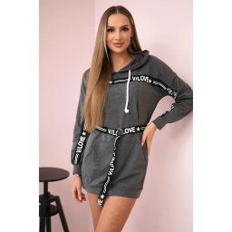 Dress decorated with a graphite slogan tape