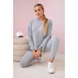 Complete with an oversized blouse in gray color