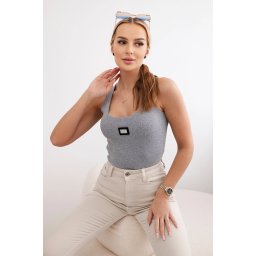 Striped blouse with a gray metal plate