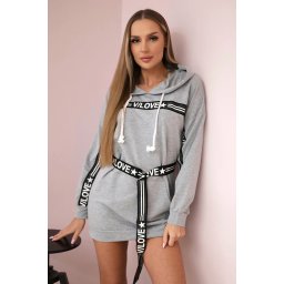 Dress decorated with a tape with gray inscriptions